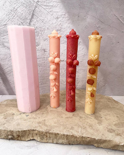 candle with pomegranate design