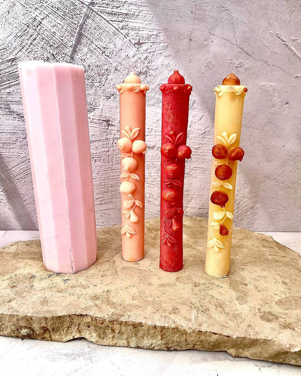 candle with pomegranate design