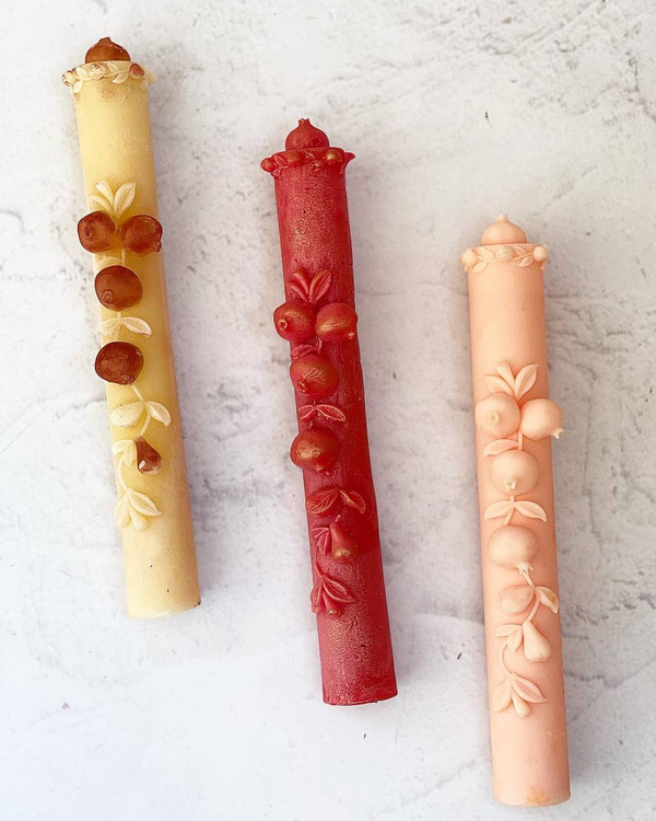 candle with pomegranate design
